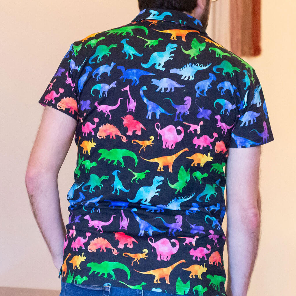 Adult "Prehistoric Parade" Rainbow of Dinosaurs Short Sleeve Polo Shirt
