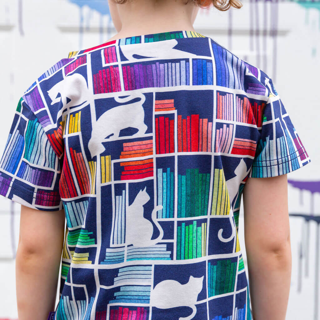 "Check Meowt" Rainbow Books & Cats Henley Short Sleeve Tee