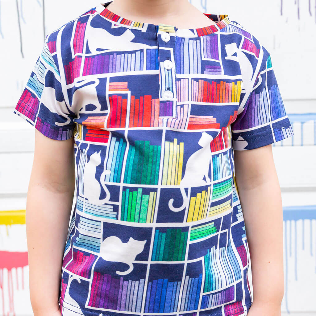 "Check Meowt" Rainbow Books & Cats Henley Short Sleeve Tee