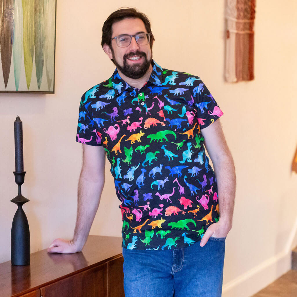 Adult "Prehistoric Parade" Rainbow of Dinosaurs Short Sleeve Polo Shirt
